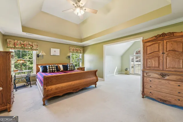 an aerial view of a house with a yard and fountain