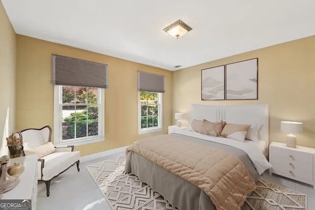 a front view of a building with a garden