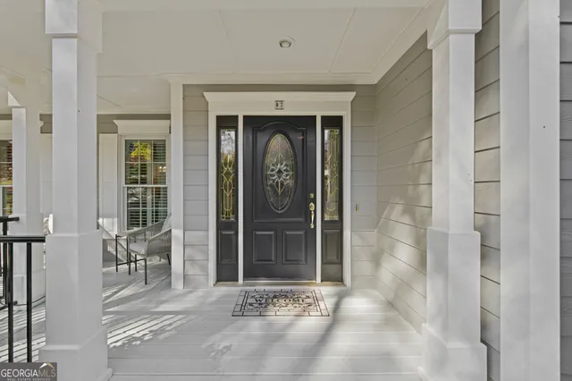 a view of a house with a wooden deck