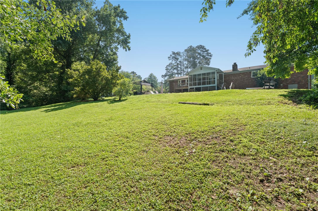 200 Echo Circle Easley, SC 29642 - Photo 28 of 35 A spacious backyard with mature trees and a private screened-in porch for outdoor enjoyment.