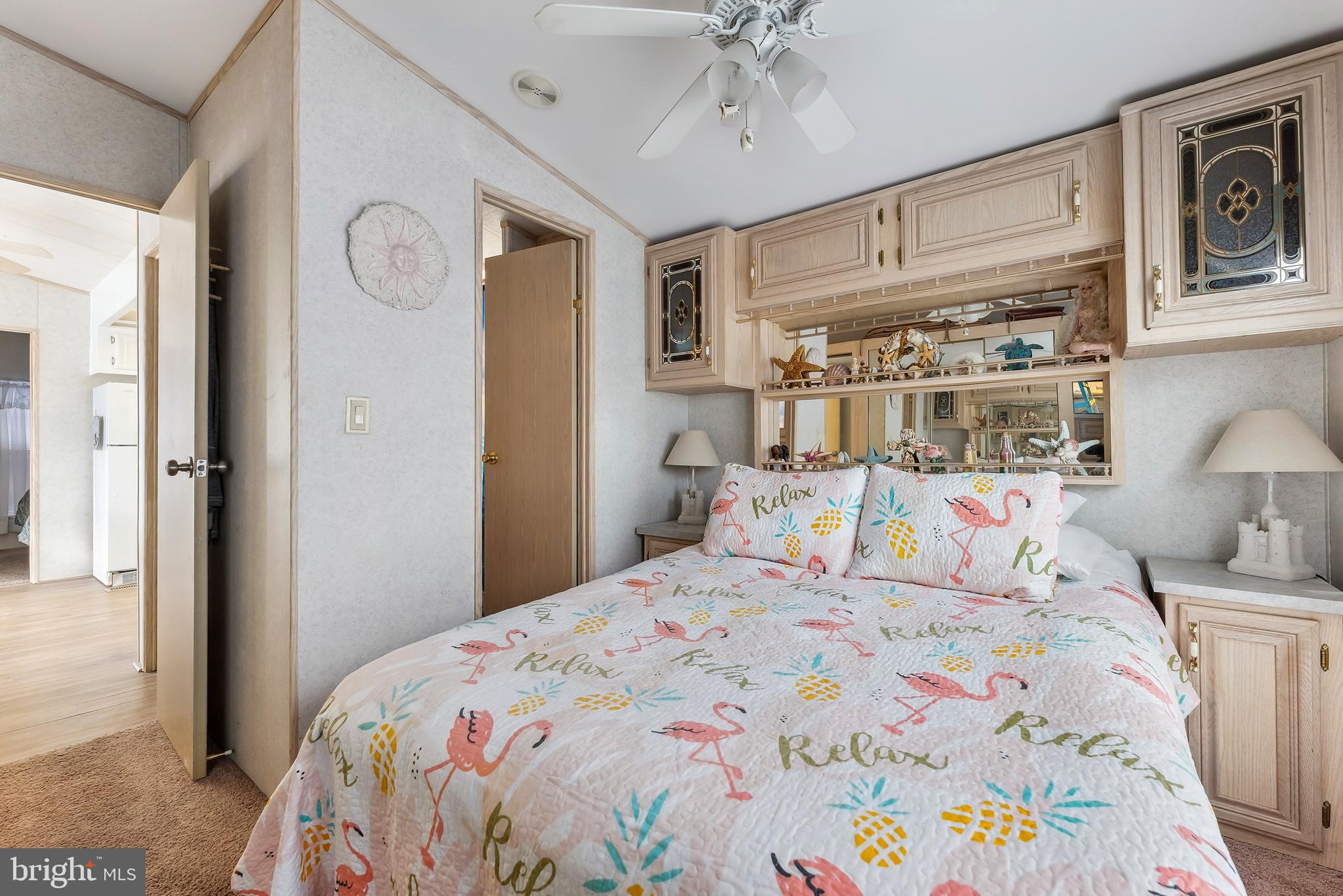 169 Edson, Unit 169 Woodbine, NJ 08270 - Photo 15 of 45 a bedroom with a bed and a chandelier