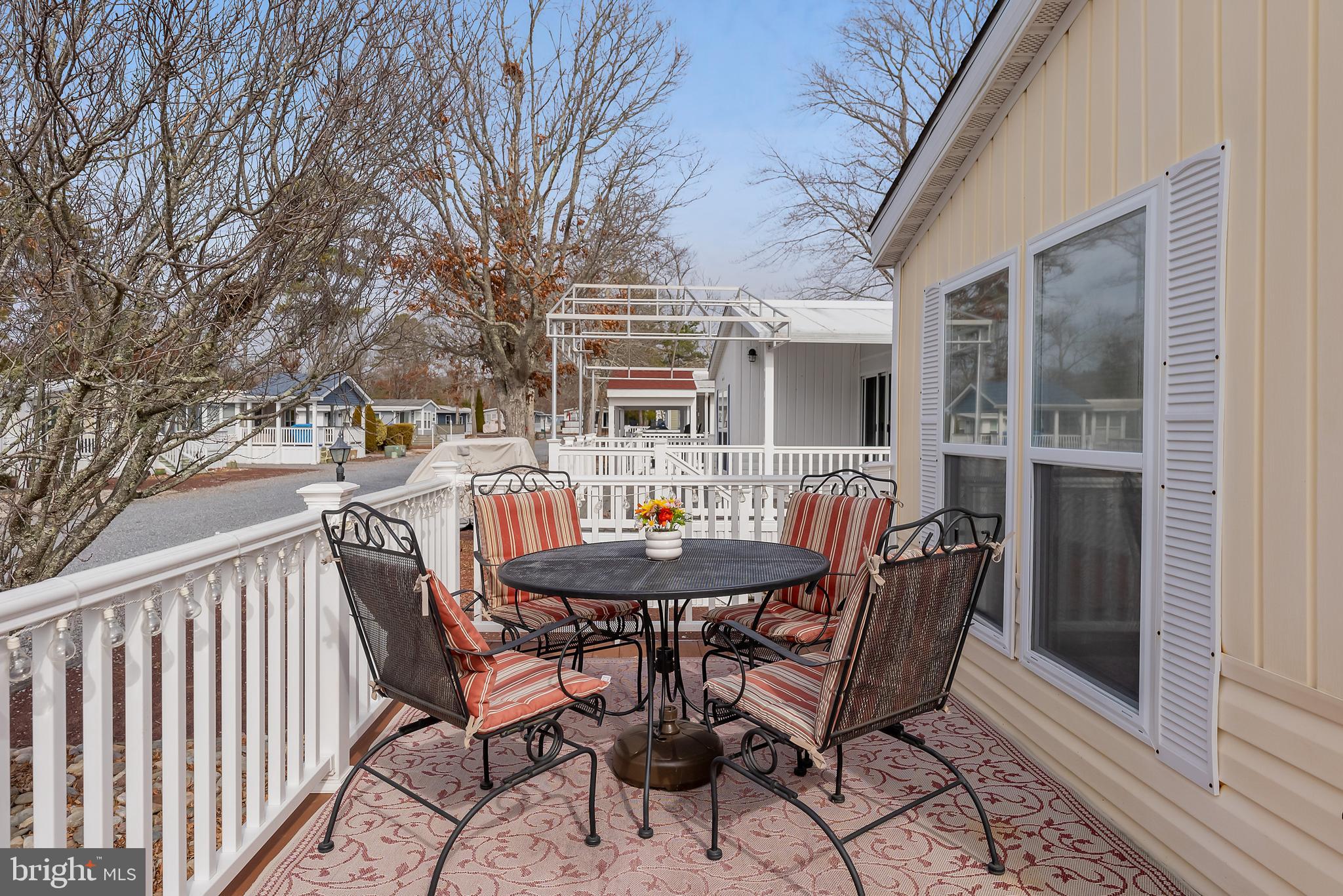 169 Edson, Unit 169 Woodbine, NJ 08270 - Photo 23 of 45 a view of a house with a table and chairs