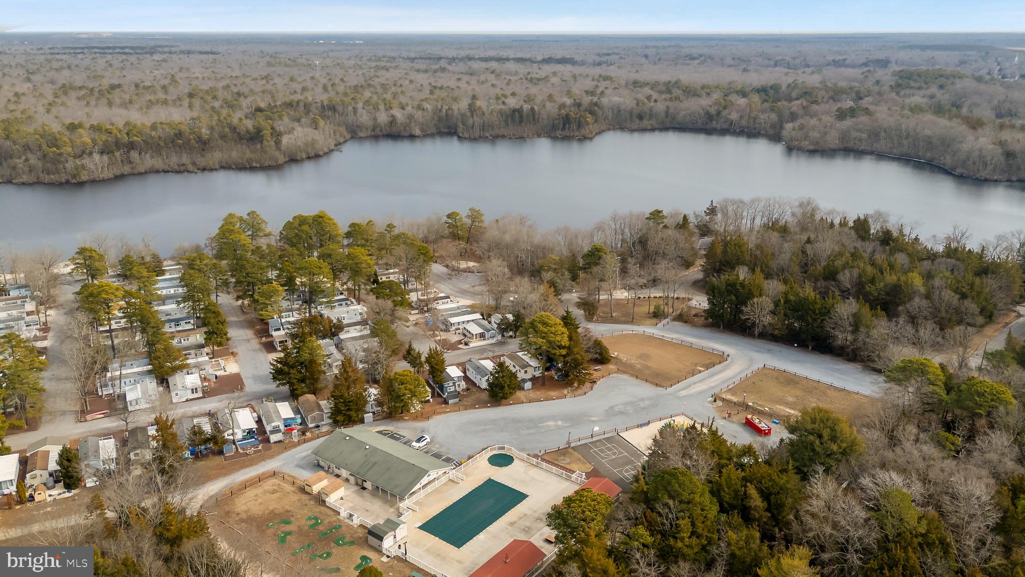 169 Edson, Unit 169 Woodbine, NJ 08270 - Photo 34 of 45 an aerial view of lake and residential houses with outdoor space