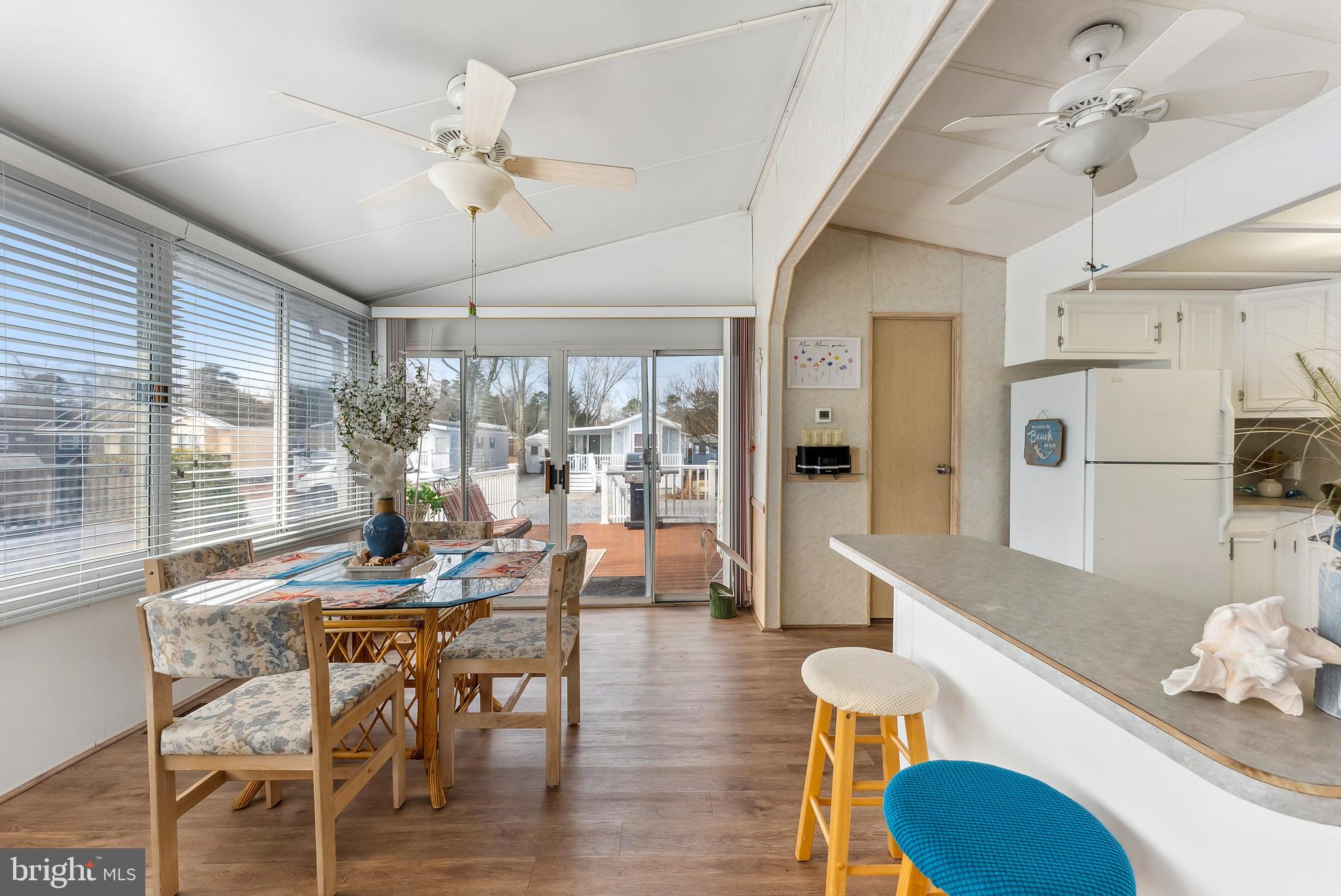 169 Edson, Unit 169 Woodbine, NJ 08270 - Photo 4 of 45 a view of a dining room with furniture wooden floor and chandelier