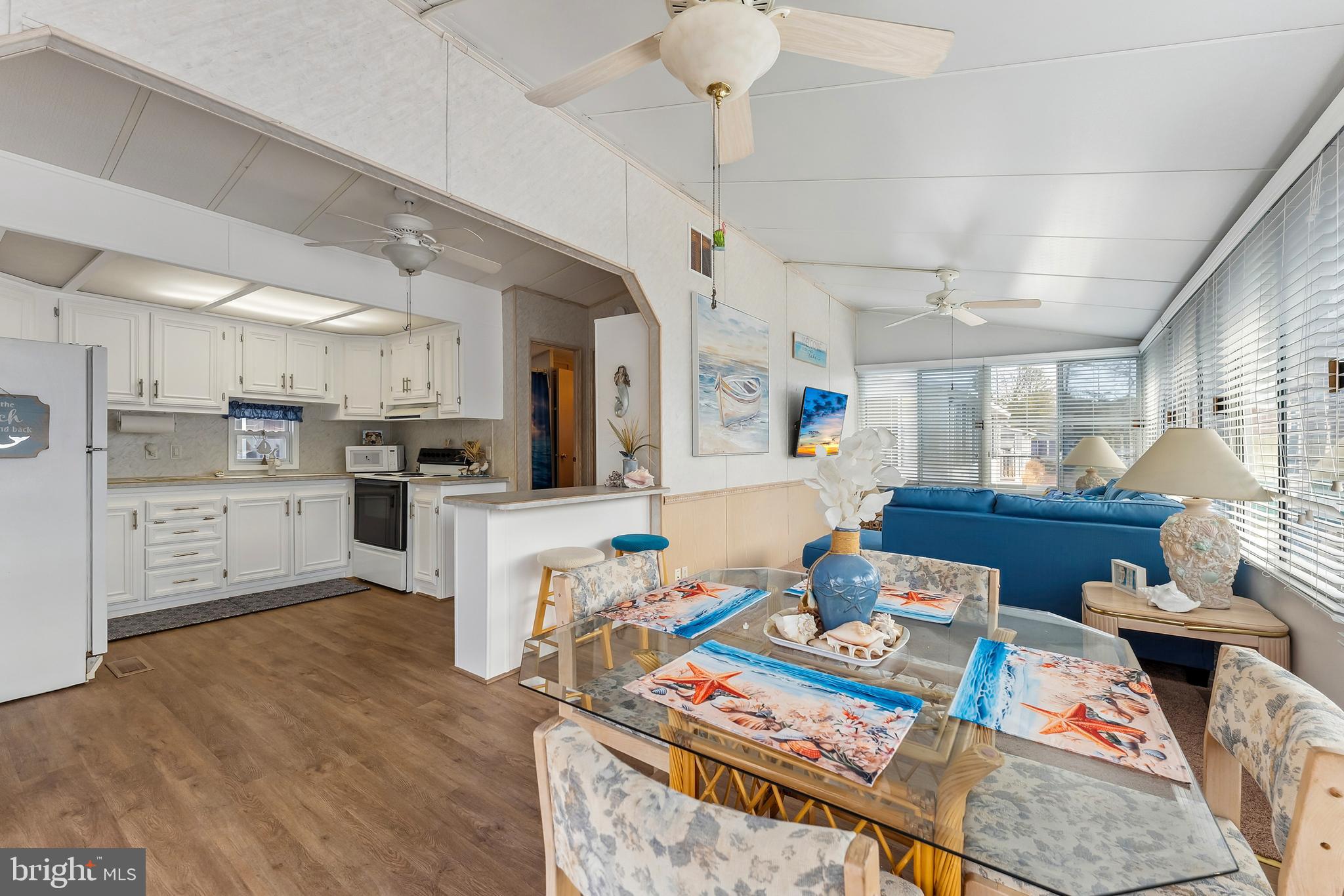 169 Edson, Unit 169 Woodbine, NJ 08270 - Photo 6 of 45 a living room with stainless steel appliances furniture stove and a kitchen view