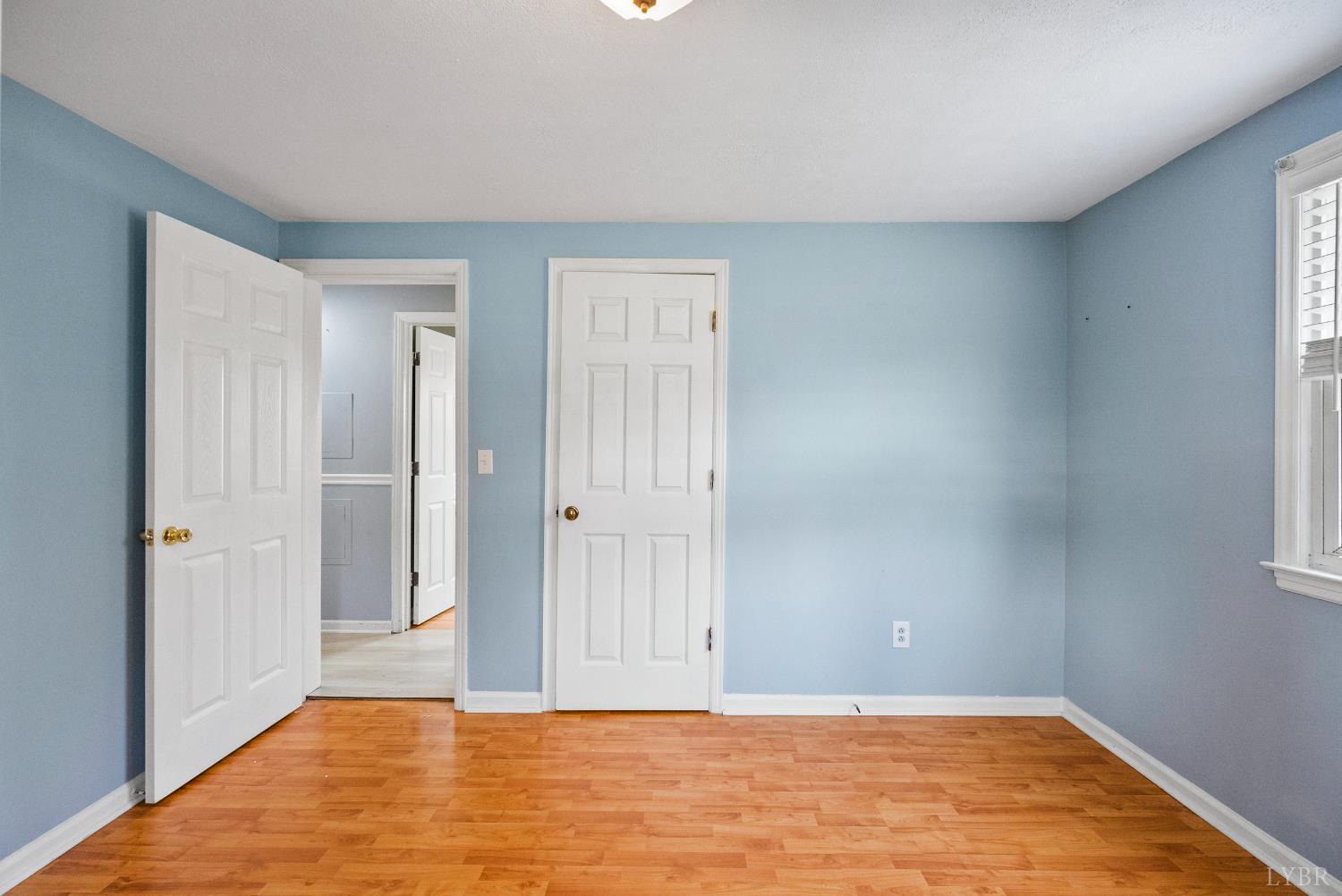 997 Toytown Road Amherst, VA 24521 - Photo 18 of 50 a view of an empty room with wooden floor