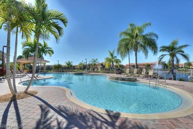 15389 Summit Pl Circle, Unit 286 Naples, FL 34119 - Photo 25 of 29 Community pool with a patio and a gazebo
