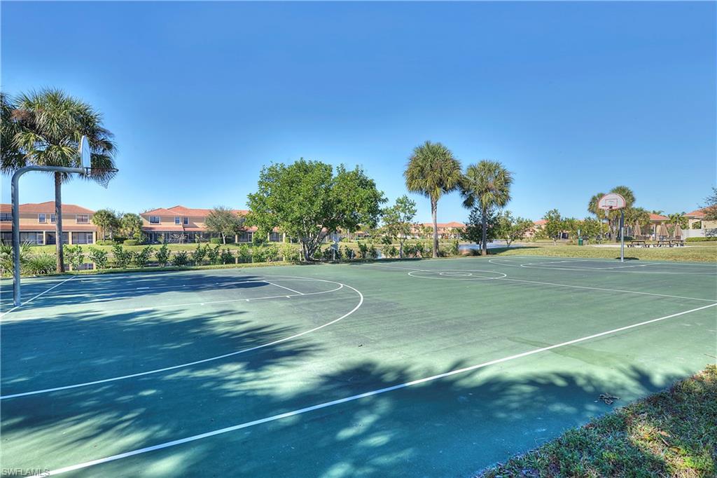 15389 Summit Pl Circle, Unit 286 Naples, FL 34119 - Photo 27 of 29 View of basketball court featuring community basketball court and a residential view