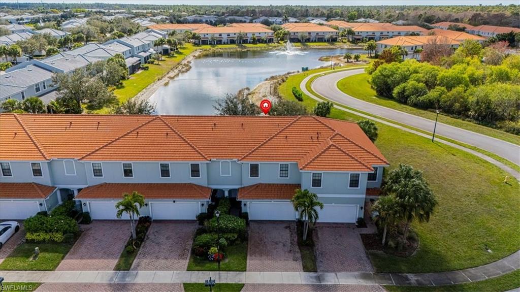 15389 Summit Pl Circle, Unit 286 Naples, FL 34119 - Photo 3 of 29 Aerial perspective of suburban area with a large body of water