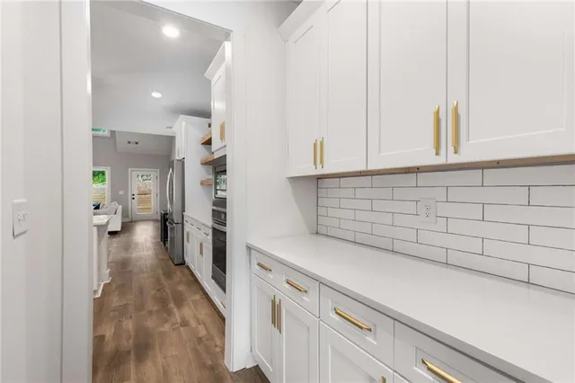 a view of a kitchen cabinets and a counter place