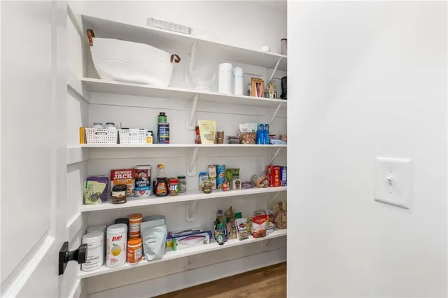a shelf with books and knick knacks on it