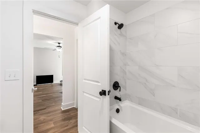 a view of bathroom with a sink mirror and toilet