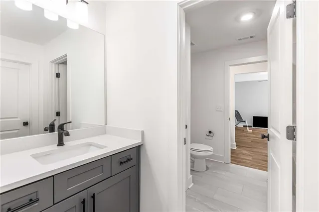 a view of an empty room and wooden floor