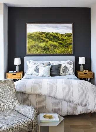 a bedroom with a bed and a night stand