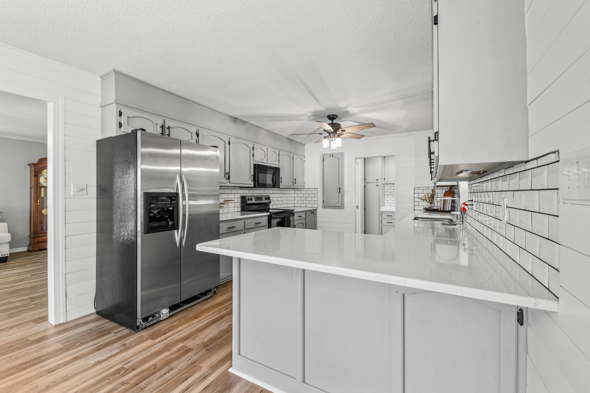 1336 Charlotte Drive Pulaski, TN 38478 - Photo 12 of 65 a kitchen with stainless steel appliances kitchen island granite countertop a refrigerator and a sink