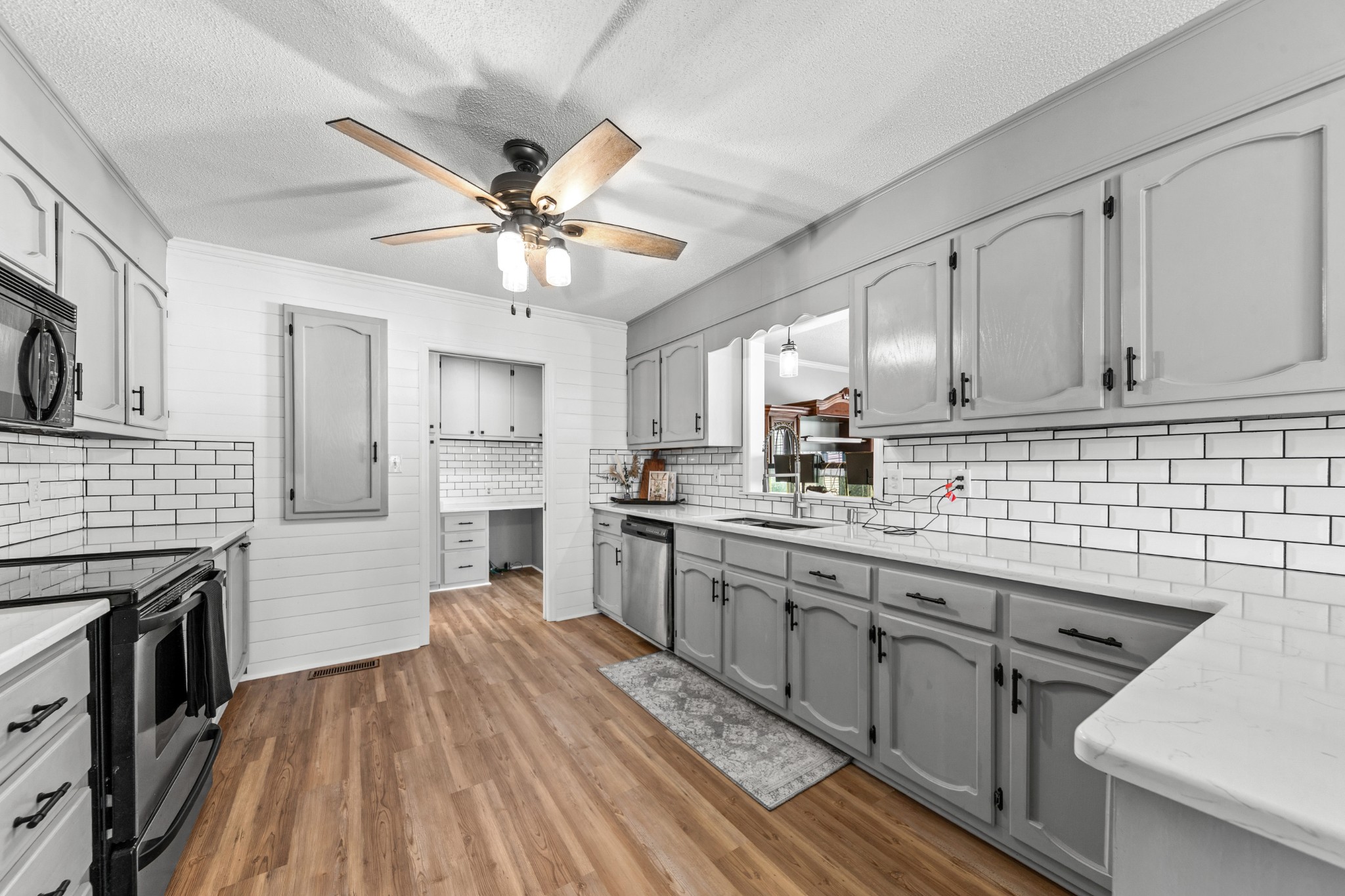 1336 Charlotte Drive Pulaski, TN 38478 - Photo 14 of 65 a kitchen with stainless steel appliances granite countertop a stove cabinets and wooden floor