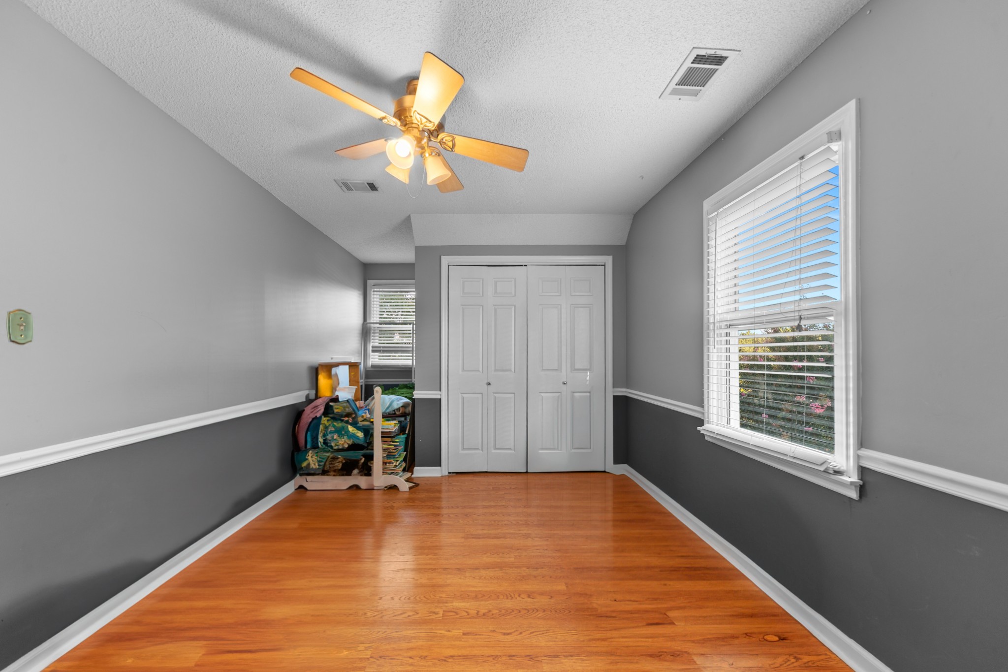 1336 Charlotte Drive Pulaski, TN 38478 - Photo 49 of 65 a view of a room with wooden floor and ceiling fan