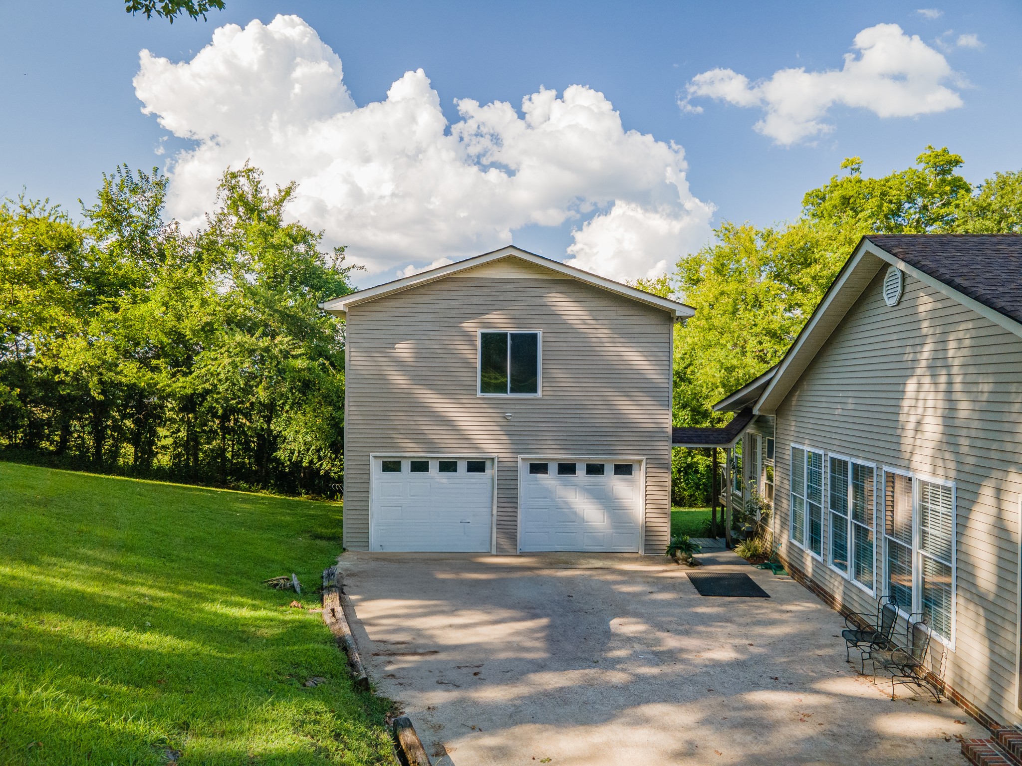 1336 Charlotte Drive Pulaski, TN 38478 - Photo 57 of 65 a front view of a house with a yard and garage