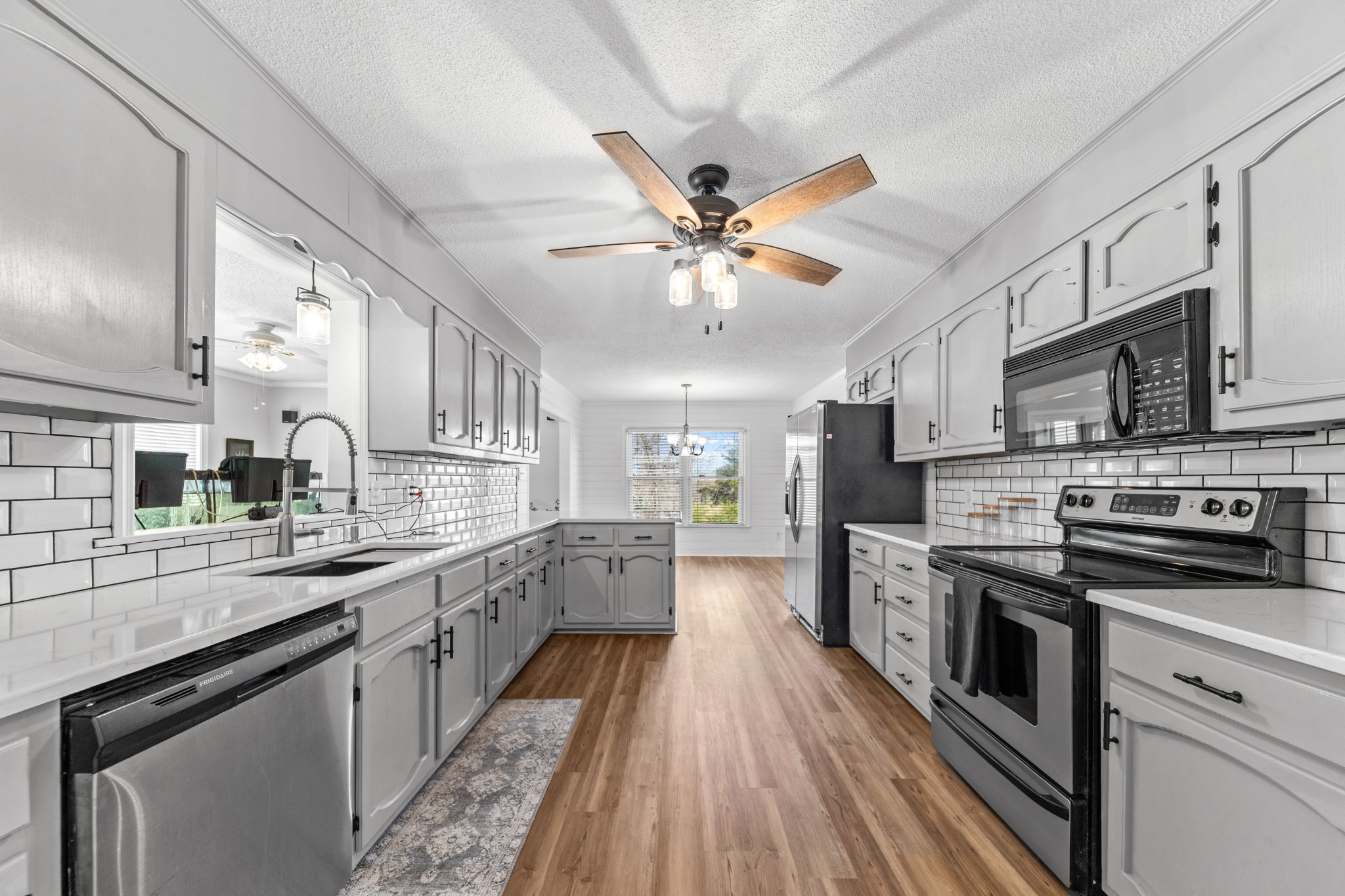 1336 Charlotte Drive Pulaski, TN 38478 - Photo 6 of 65 a large kitchen with stainless steel appliances granite countertop a lot of counter space and wooden floors