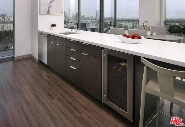 a room with a large window and furniture