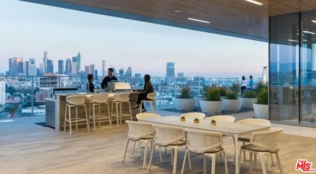 a balcony with table and chairs