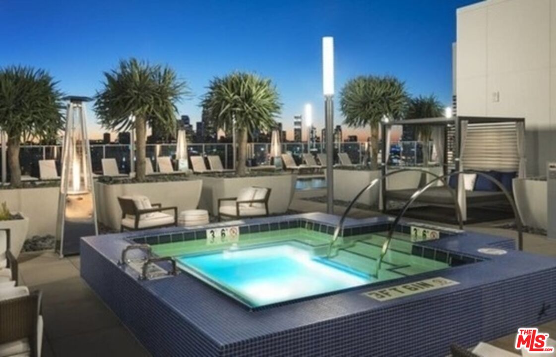 3033 Wilshire Boulevard, Unit 1707 Los Angeles, CA 90020 - Photo 21 of 32 a view of a swimming pool with chairs