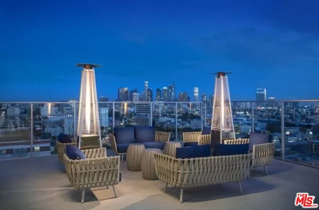 a view of a backyard with sitting area