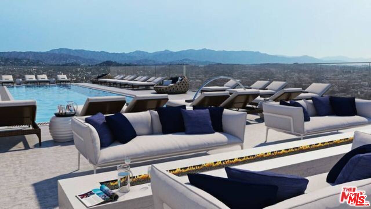 3033 Wilshire Boulevard, Unit 1707 Los Angeles, CA 90020 - Photo 29 of 32 a view of a terrace with couches and lounge chairs