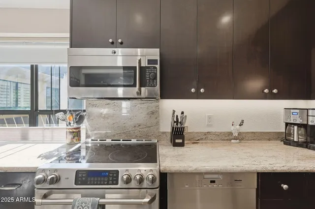 a kitchen with a stove and a microwave