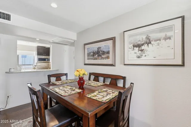 a view of a dining room with furniture and wooden floor