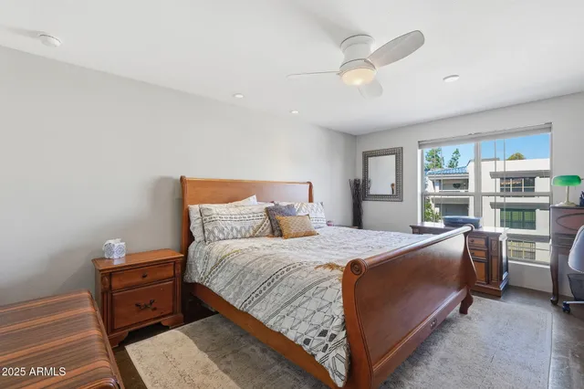 a bed room with a bed and a window