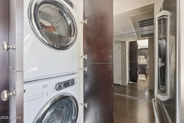 a view of a hallway with washer and dryer