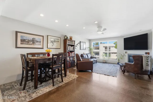 a view of a livingroom with furniture and a flat screen tv