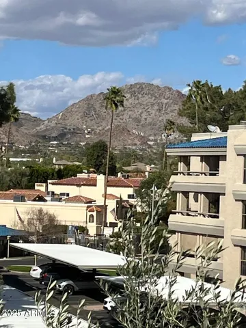 a view of a park with a house