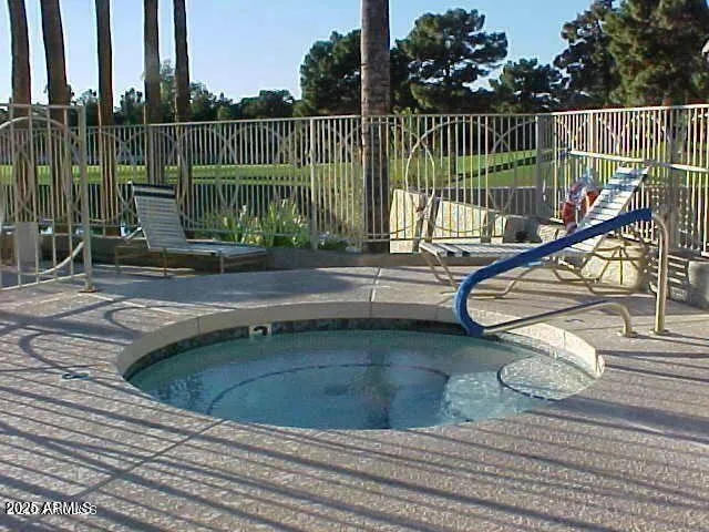 a swimming pool with outdoor seating yard and outdoor seating