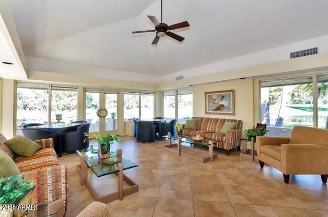 a view of a lake with houses in the background
