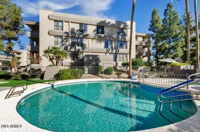 a lake view with a table and chairs