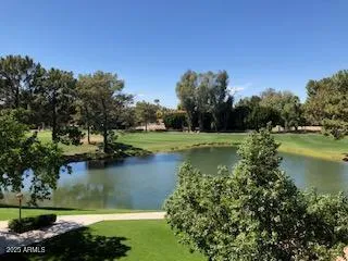 a roof deck with a table and chairs