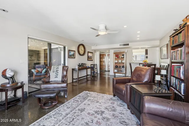a living room with furniture rug and window
