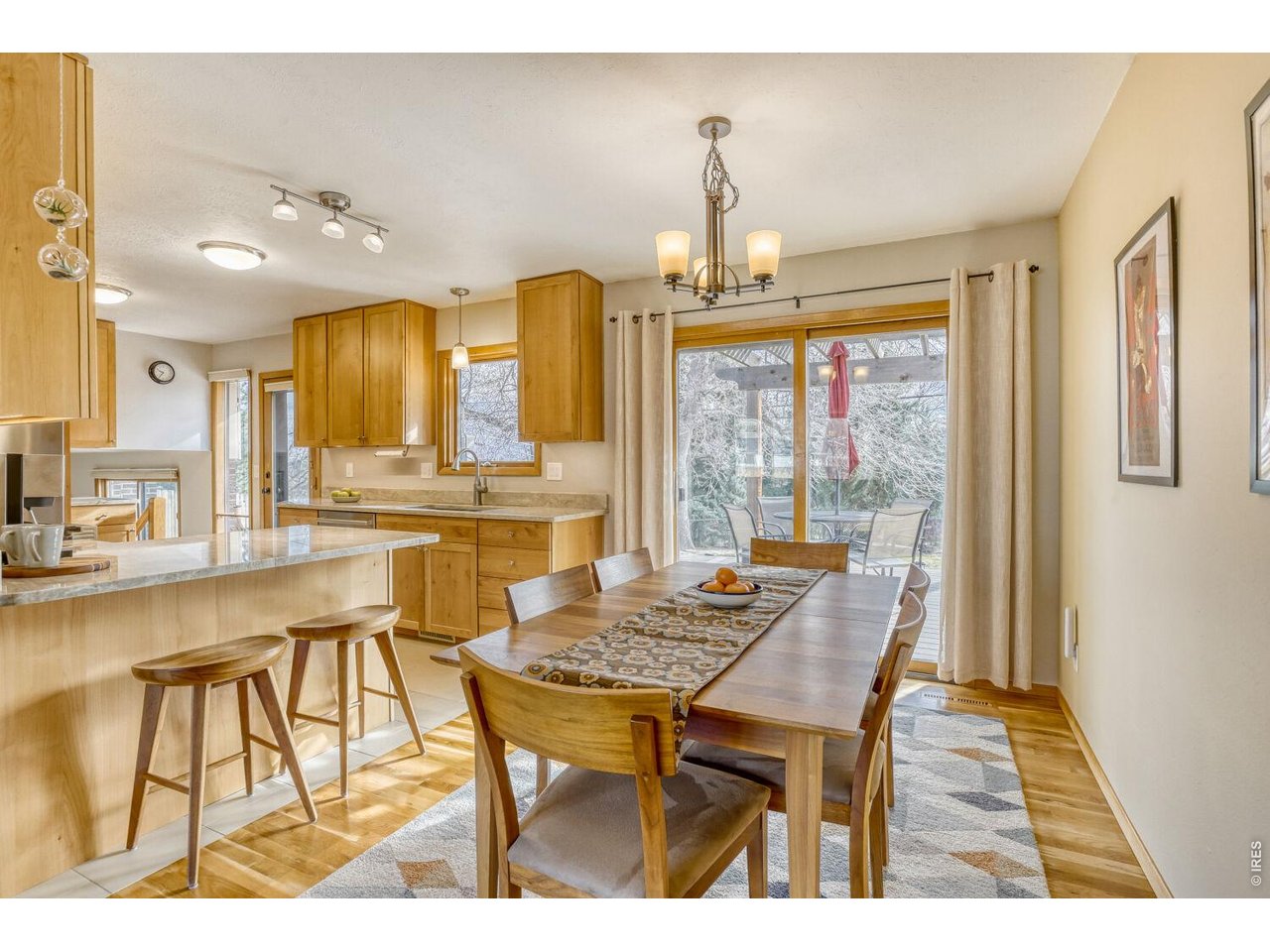 1270 Lehigh Street Boulder, CO 80305 - Photo 7 of 24 Separate dining adjacent to kitchen with breakfast bar and direct access to the back patio