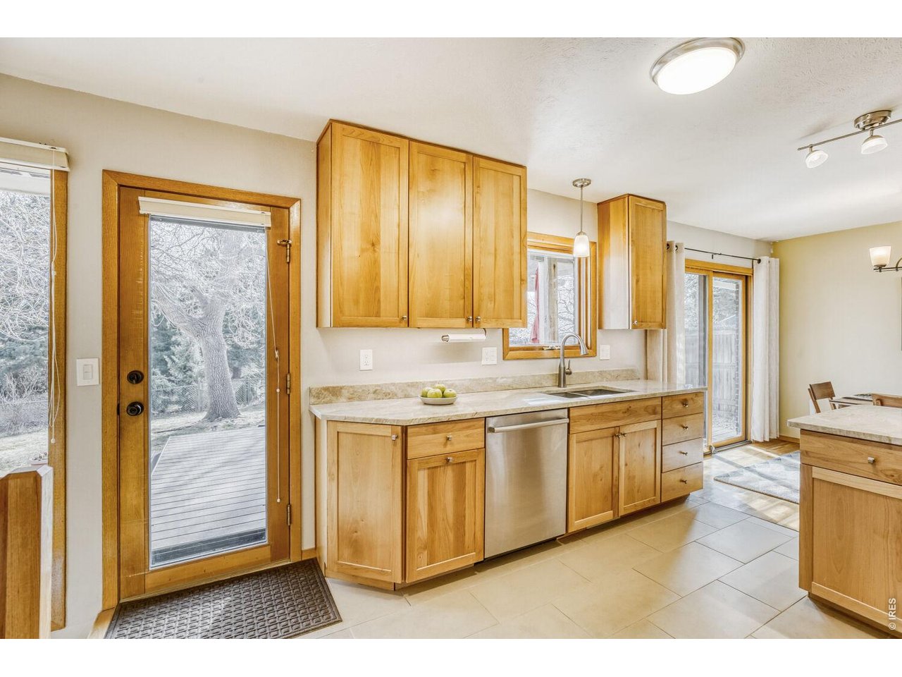 1270 Lehigh Street Boulder, CO 80305 - Photo 9 of 24 Remodeled kitchen with SS appliances and 2nd egress to backyard