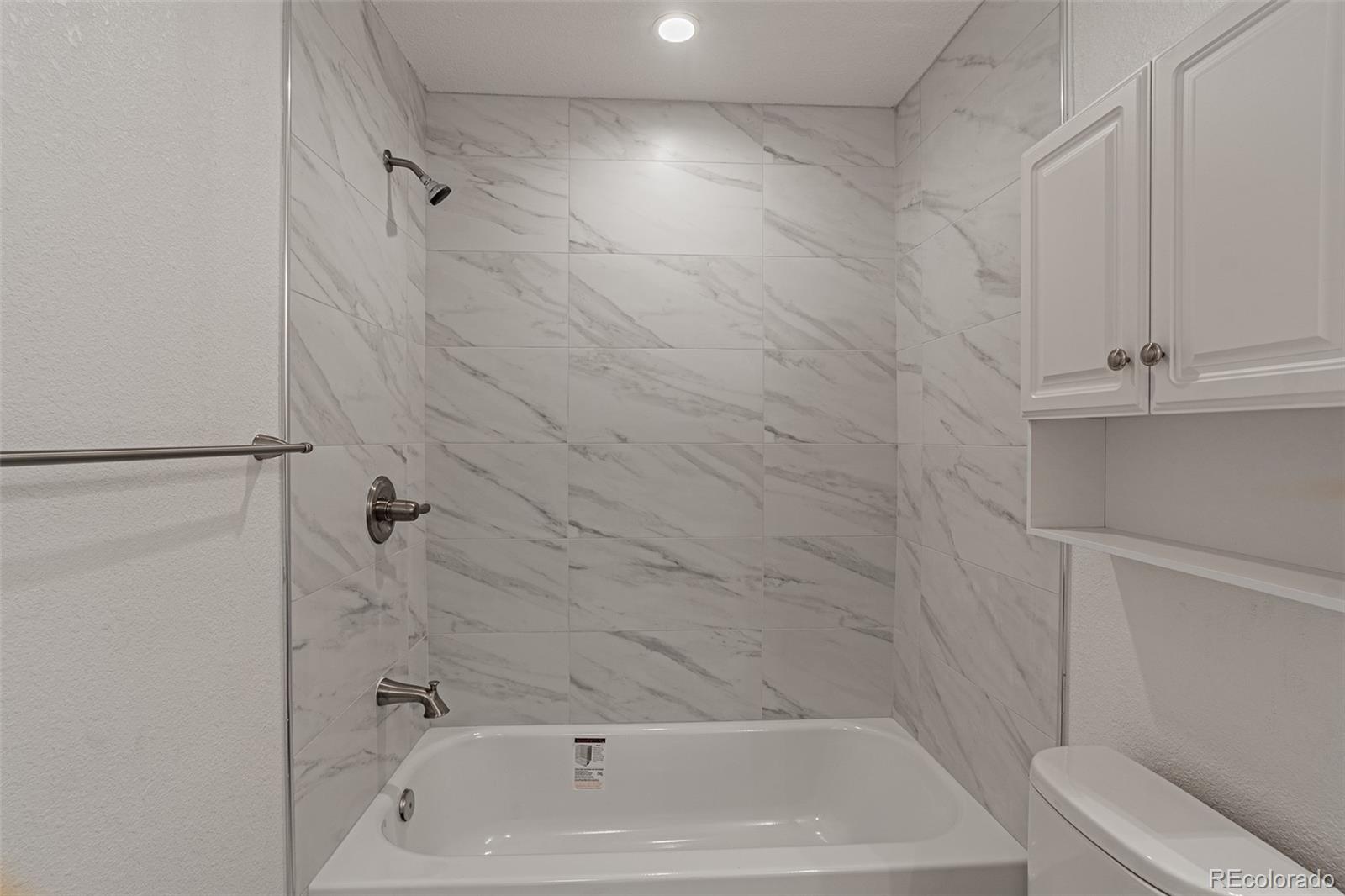 3360 Magnolia Street Denver, CO 80207 - Photo 11 of 31 a bathroom with a tub