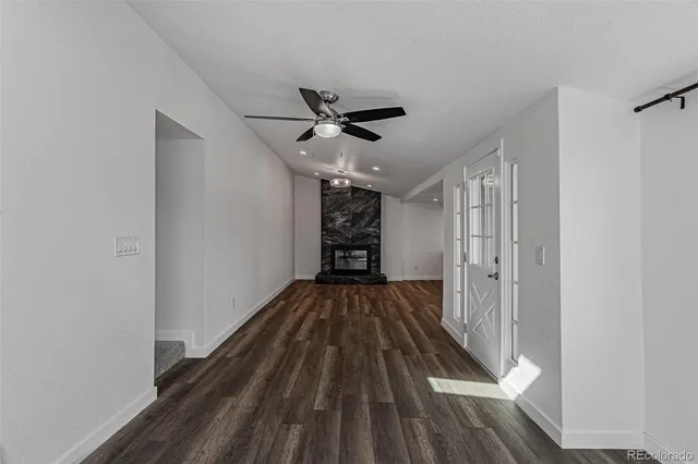 a bathroom with a shower sink vanity mirror and toilet