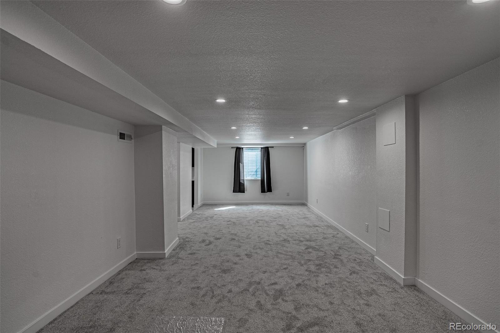 3360 Magnolia Street Denver, CO 80207 - Photo 24 of 31 a view of livingroom and a window