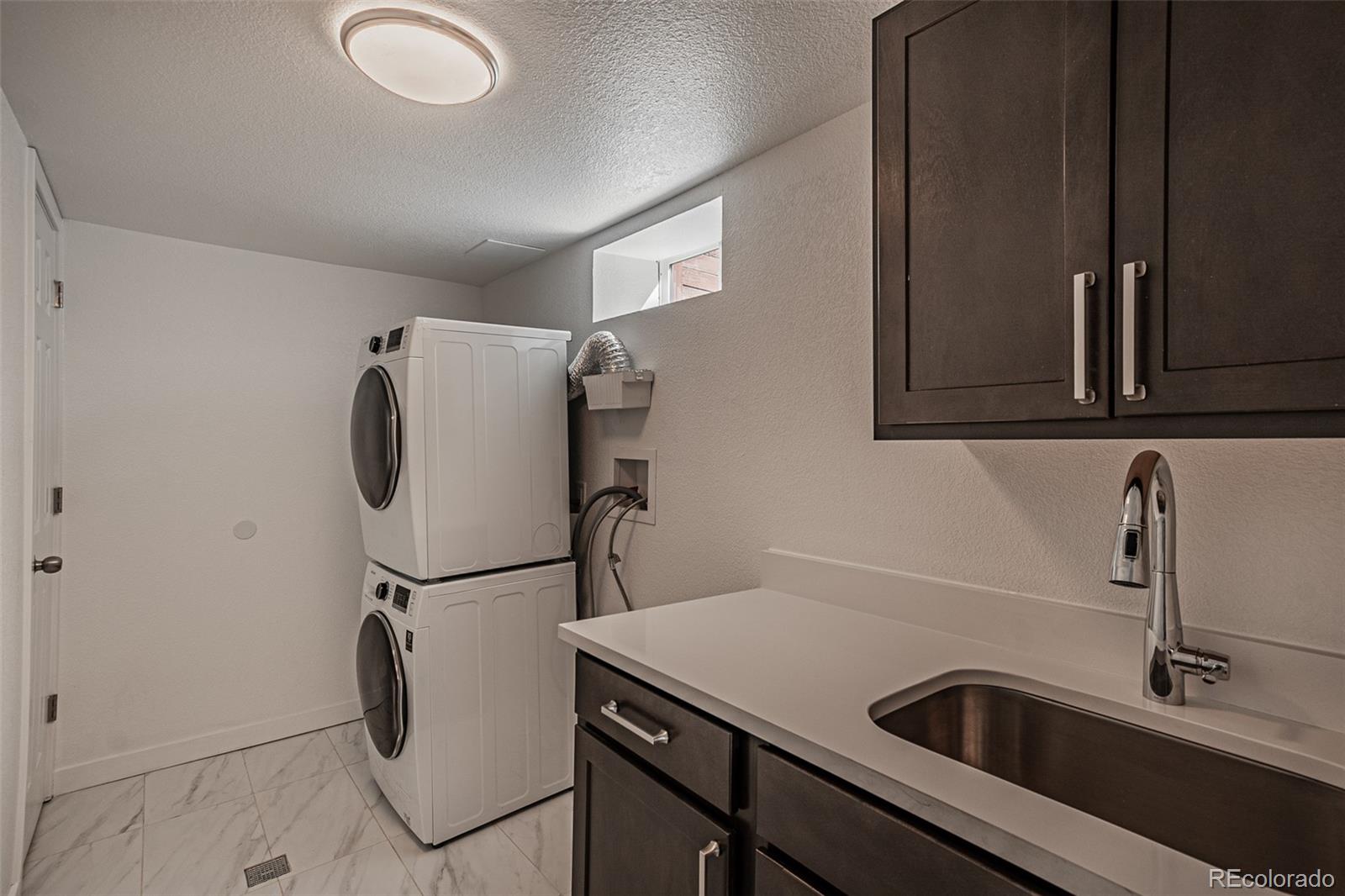3360 Magnolia Street Denver, CO 80207 - Photo 27 of 31 a close view of a sink and cabinets