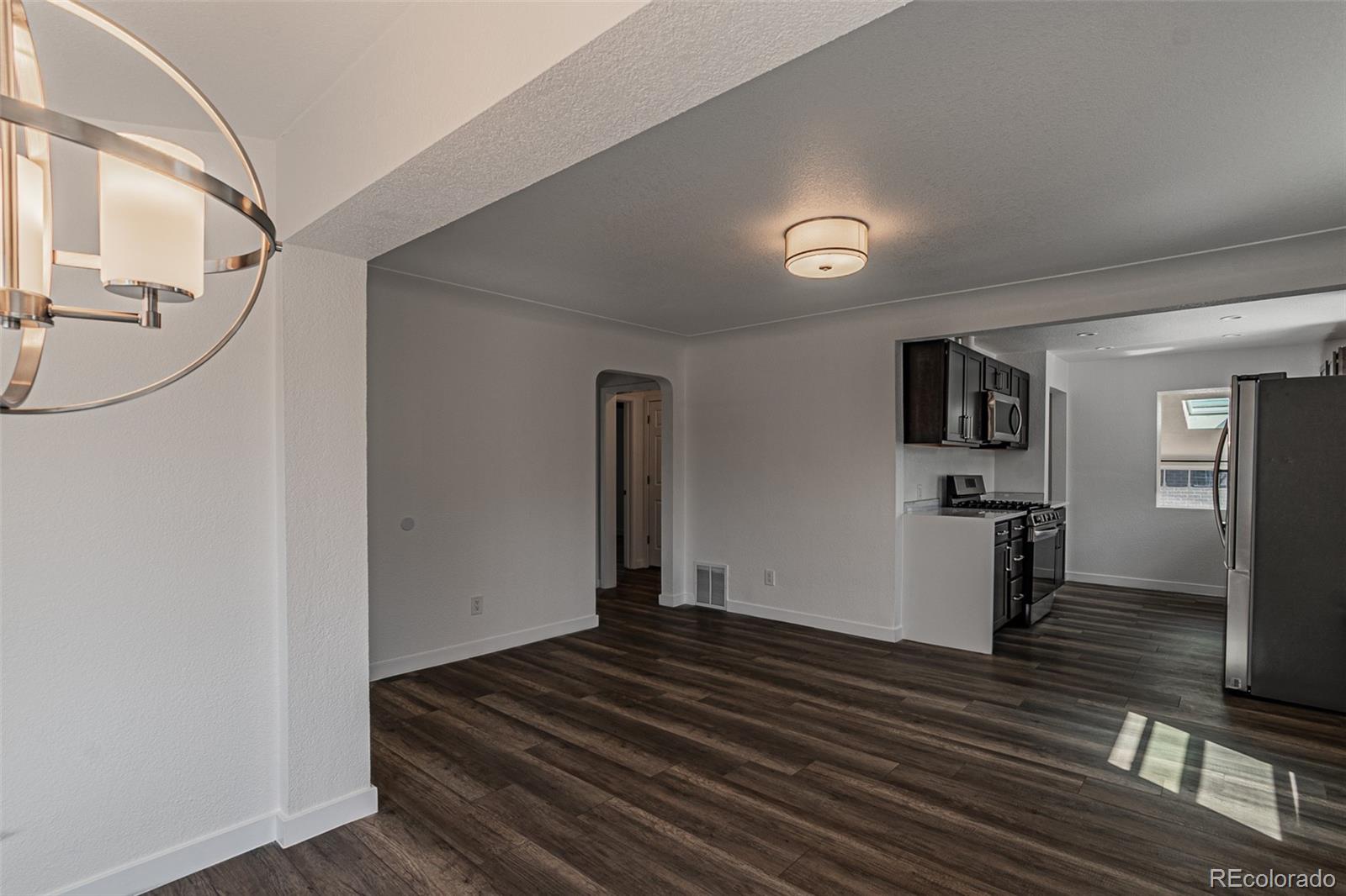 3360 Magnolia Street Denver, CO 80207 - Photo 4 of 31 a view of a living room