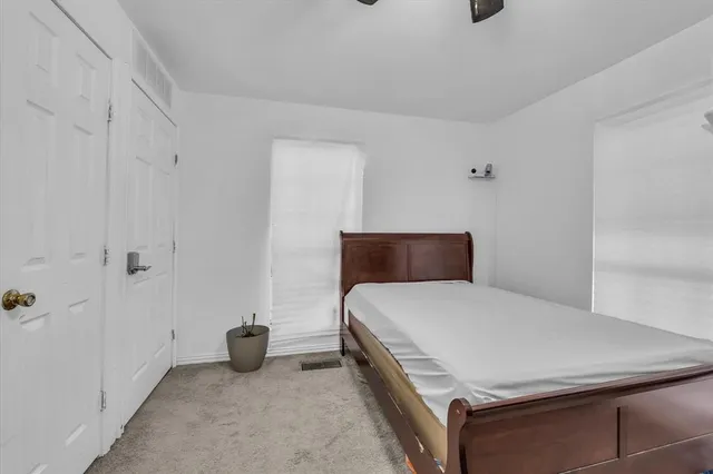 a bedroom with a bed and a table