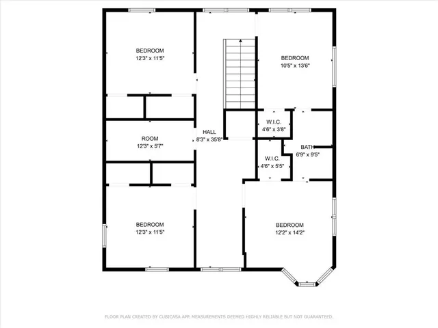 a picture of a bench in front of a wall