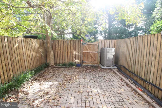 a view of a backyard with fence