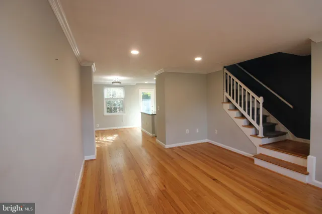 a view of entryway with wooden floor
